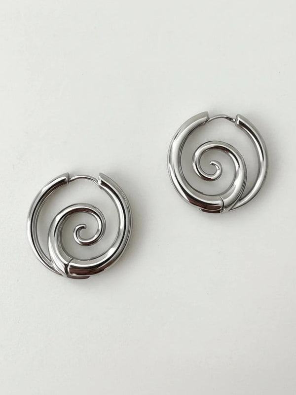 Spiral hoop earrings on model