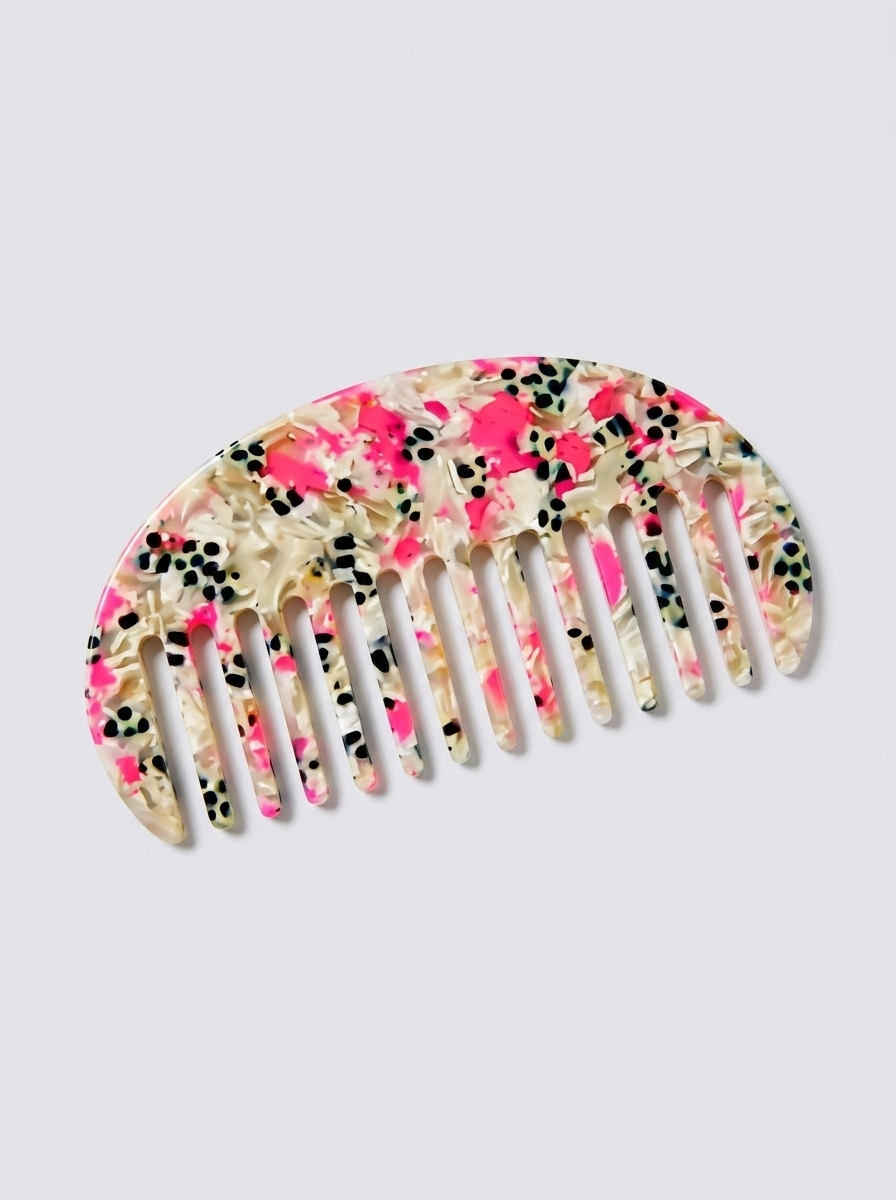 Half moon acetate hair comb on surface - styling view