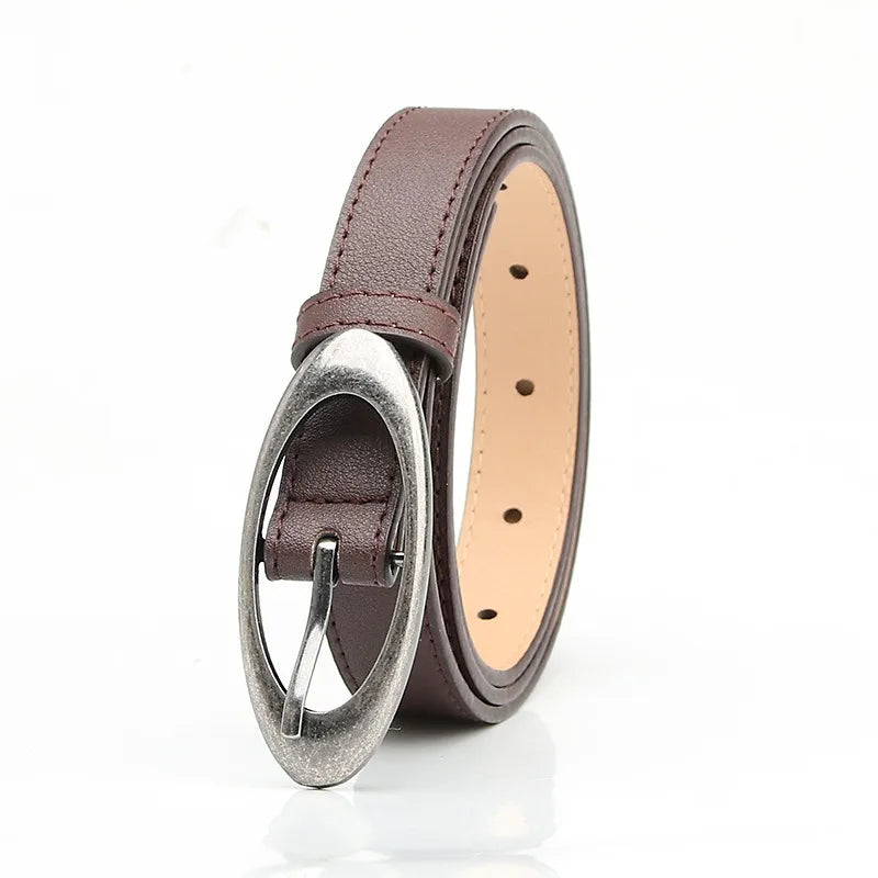 Oval buckle belt flat lay - styling view