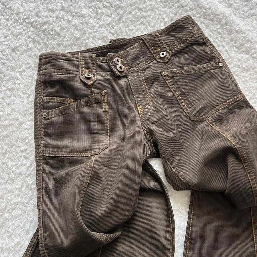 Brown corduroy low rise flare pants on model - detail shot