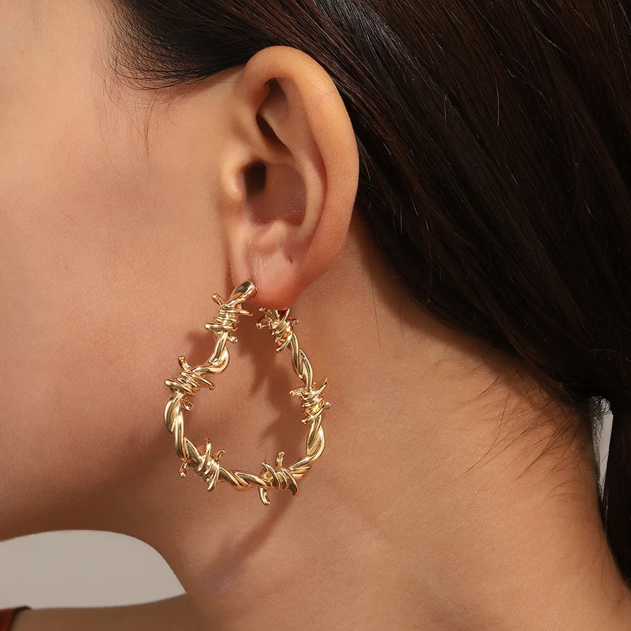 Barbed wire heart hoop earrings close up - detail shot