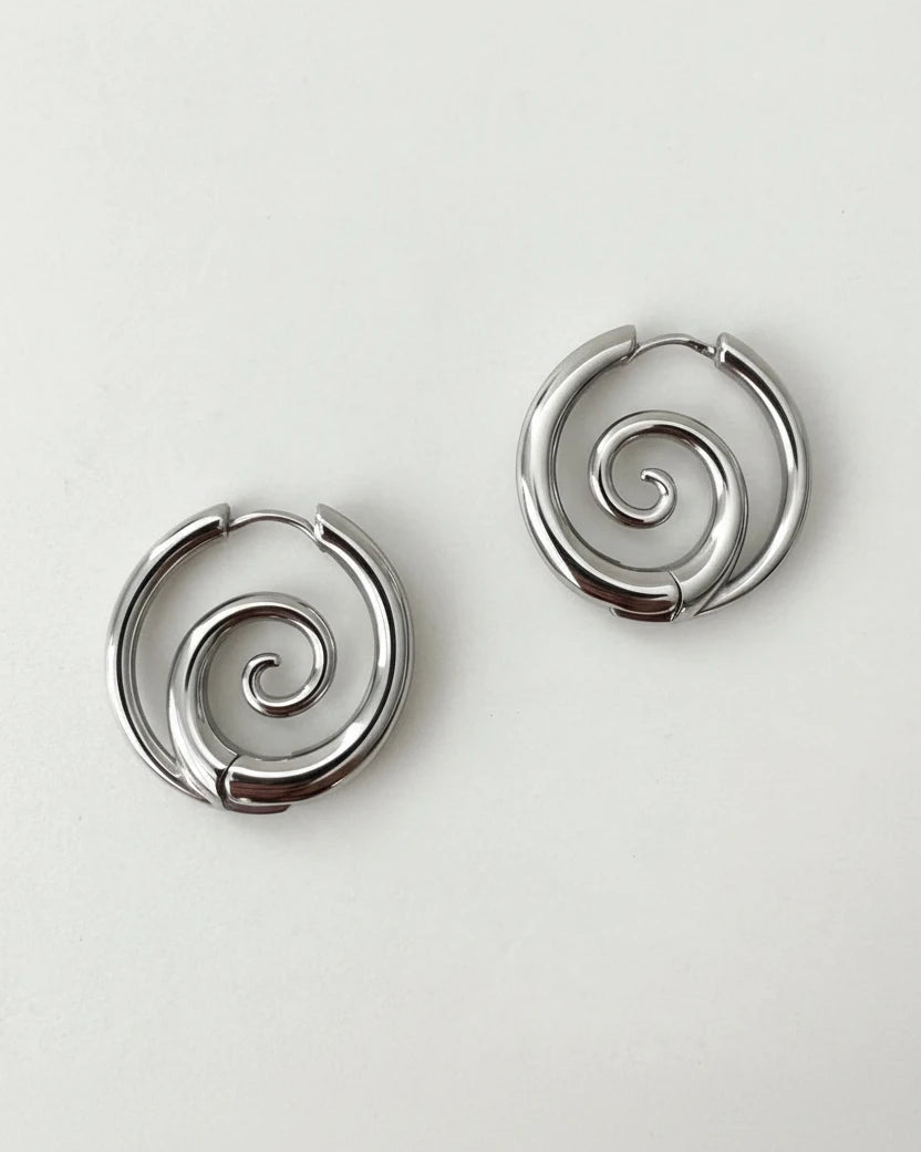 Spiral hoop earrings on model