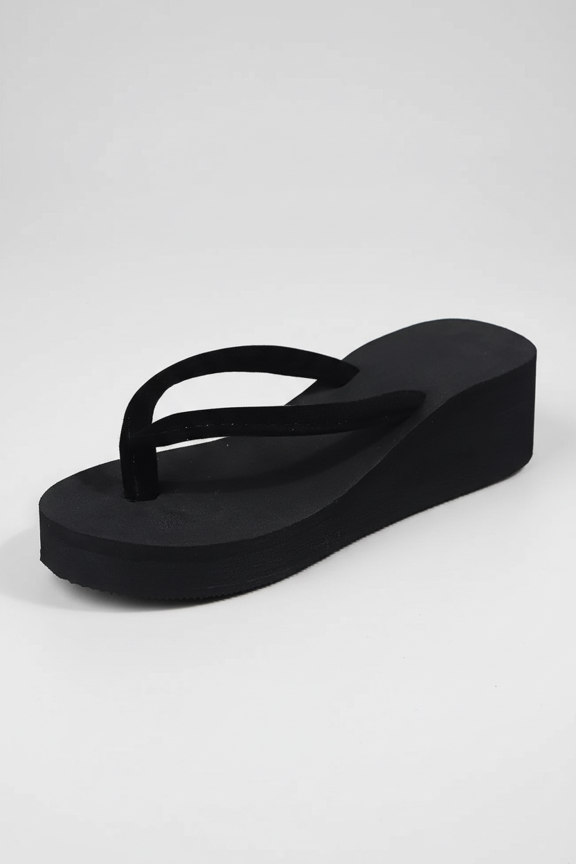Foam platform flip flops on feet