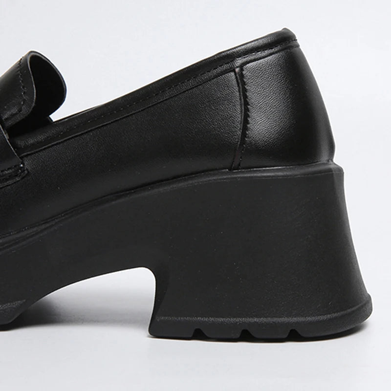 Platform penny loafers on feet - detail shot