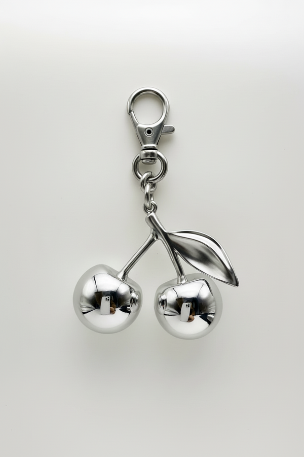 Mirror cherry bag charm on bag