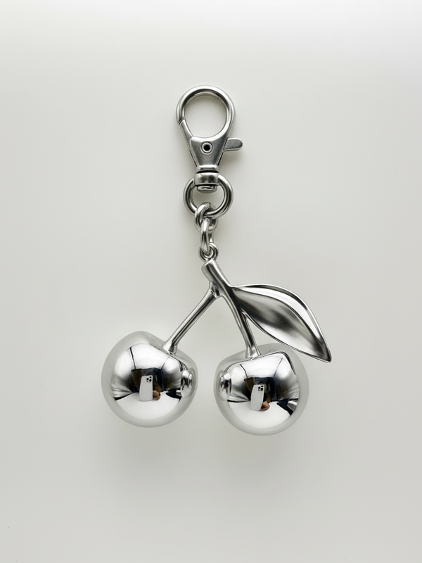 Mirror cherry bag charm on bag