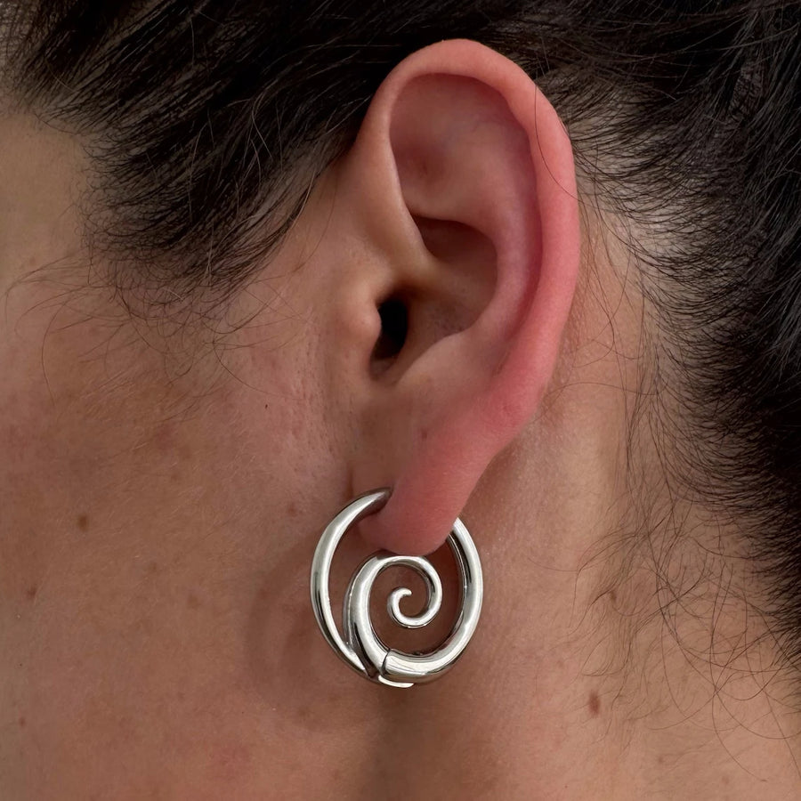 Spiral hoop earrings on model - styling view