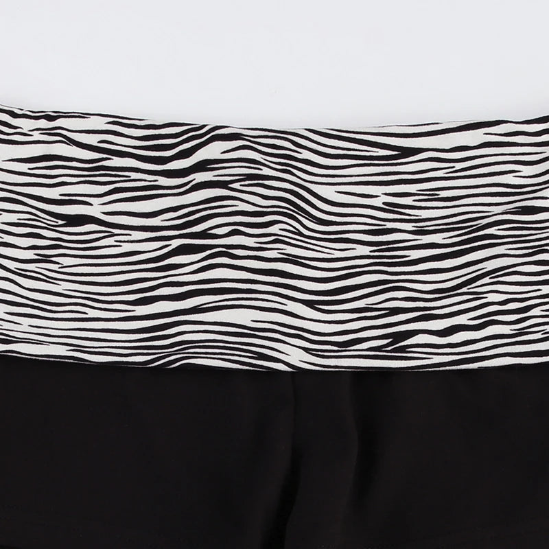 Low rise zebra print shorts on model - styling view