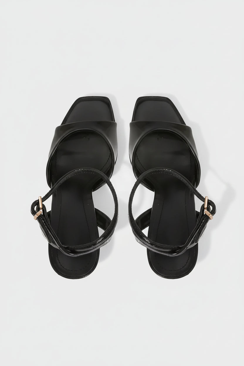Square toe ankle strap stiletto heels on model - detail shot