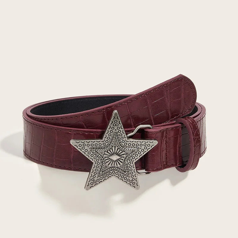 Star buckle belt flat lay - detail shot