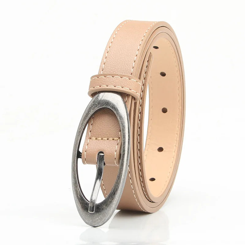 Oval buckle belt flat lay - detail shot