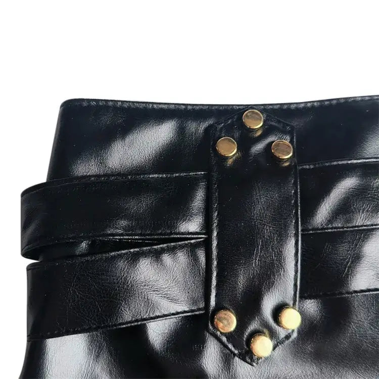 Low rise faux leather micro shorts on model - styling view