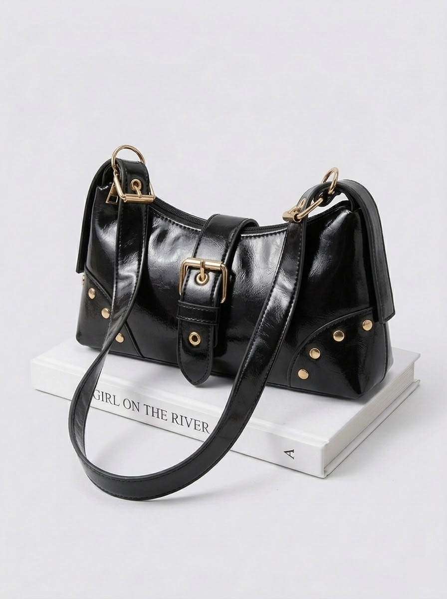 Studded buckle shoulder bag flat lay - styling view