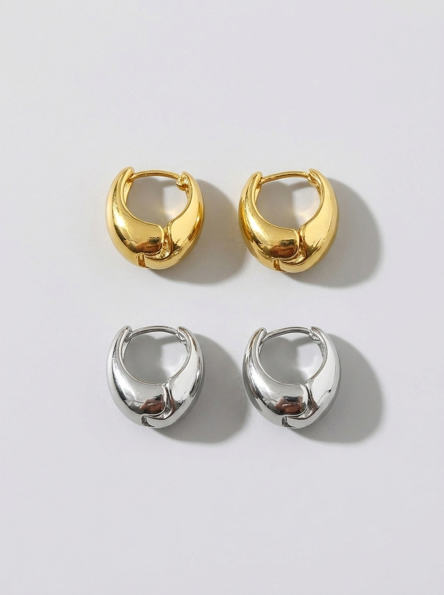 Chunky dome hoop earrings on model - detail shot