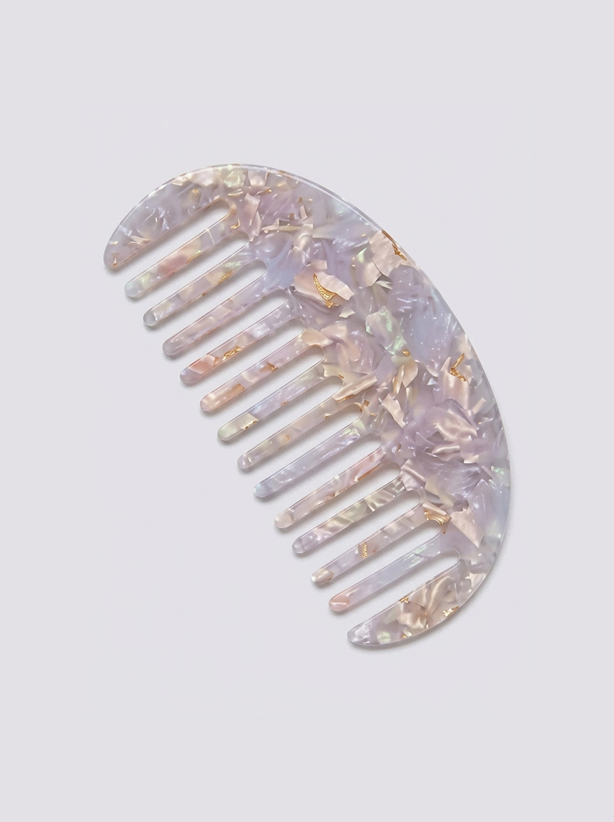 Half moon acetate hair comb on surface - view 10