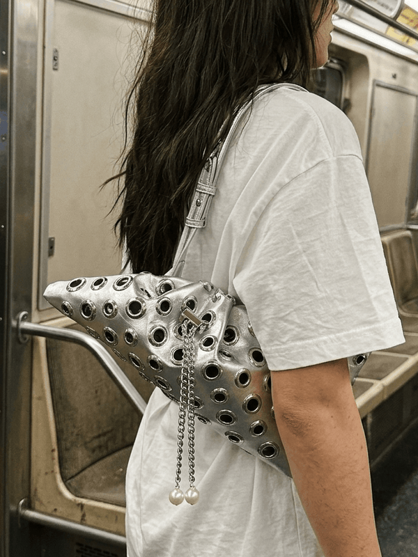 Drawstring rivet studded shoulder bag