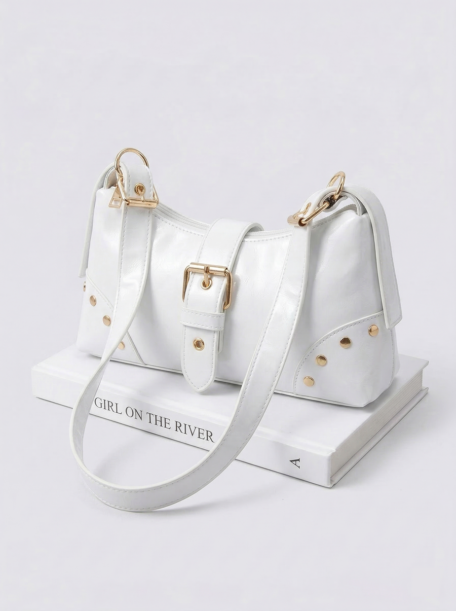 Studded buckle shoulder bag flat lay - detail shot