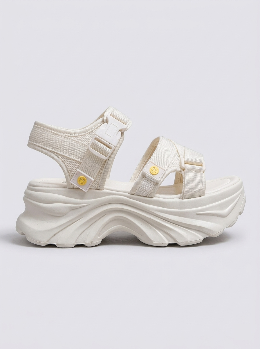 Wave molded platform sandals on feet - detail shot